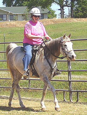 Raba being ridden by Carol Mulder (age 74).